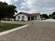 Lovely home with a brick driveway, garage, and well-maintained landscaping at 18132 E Vencino St, Gilbert, AZ 85298