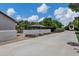 Exterior view showcasing a gazebo, mature trees, and a recreational vehicle parking space adjacent to the main house at 18132 E Vencino St, Gilbert, AZ 85298