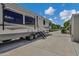Spacious RV parking pad and a large, functional storage building enhance the property's utility and appeal at 18132 E Vencino St, Gilbert, AZ 85298