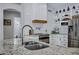 Beautiful kitchen featuring granite counters, a tile backsplash, stainless appliances, and ample storage at 18132 E Vencino St, Gilbert, AZ 85298