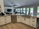 Spacious kitchen with granite countertops, farmhouse sink and stainless steel dishwasher at 18132 E Vencino St, Gilbert, AZ 85298