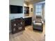 Cozy seating area with a book case and natural light at 18132 E Vencino St, Gilbert, AZ 85298