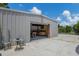 Metal Building with a finished recreation space showcasing an open entrance, custom bar, and seating area at 18132 E Vencino St, Gilbert, AZ 85298