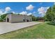 View of the backyard metal building with ample parking space and well-kept surroundings at 18132 E Vencino St, Gilbert, AZ 85298