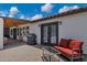 Outdoor covered patio with tiled surface, ample seating, and barbecue at 18132 E Vencino St, Gilbert, AZ 85298