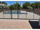 Sparkling pool with safety fence, perfect for cooling off on hot summer days at 18132 E Vencino St, Gilbert, AZ 85298