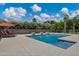 Enjoy the sparkling pool, featuring a sun shelf, water features, and relaxing lounge chairs at 18132 E Vencino St, Gilbert, AZ 85298