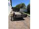 A trailer sits outside this home in the gravel driveway, ready for any work or adventures at 18132 E Vencino St, Gilbert, AZ 85298