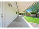 Extended covered patio offering ample space for entertaining, with a view of the lush backyard at 1831 W Seldon Ln, Phoenix, AZ 85021