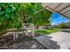 Shady backyard featuring a mature tree and a backyard playset at 1831 W Seldon Ln, Phoenix, AZ 85021