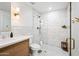 Bathroom featuring a modern vanity, glass shower, and stylish fixtures and decor at 1831 W Seldon Ln, Phoenix, AZ 85021