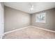 Neutral bedroom featuring a ceiling fan and plantation shutters at 1831 W Seldon Ln, Phoenix, AZ 85021