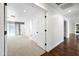 Bright bedroom with plush carpet, recessed lighting, and an open doorway to the adjacent room at 1831 W Seldon Ln, Phoenix, AZ 85021