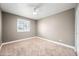 Bright bedroom featuring a ceiling fan and plantation shutters at 1831 W Seldon Ln, Phoenix, AZ 85021
