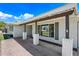 Covered front porch with brick columns and pavers, offering a welcoming entrance to the home at 1831 W Seldon Ln, Phoenix, AZ 85021