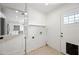 Laundry room featuring washer/dryer hookups, and door to exterior at 1831 W Seldon Ln, Phoenix, AZ 85021