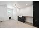 Bright laundry room with cabinets, sink and a door leading outside at 1831 W Seldon Ln, Phoenix, AZ 85021