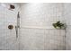 Elegant glass shower featuring a rainfall shower head and tiled walls at 1831 W Seldon Ln, Phoenix, AZ 85021