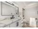 Modern bathroom featuring white cabinets, a vanity with matte black hardware, and a combined tub and shower at 19 E Boca Raton Rd, Phoenix, AZ 85022