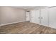 Bedroom featuring wood flooring and closet with sliding doors at 19 E Boca Raton Rd, Phoenix, AZ 85022