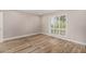 Bright bedroom with wood flooring and large window at 19 E Boca Raton Rd, Phoenix, AZ 85022