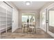 Bright breakfast nook with wood floors, storage, and view to backyard at 19 E Boca Raton Rd, Phoenix, AZ 85022