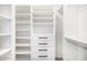 A luxurious walk-in closet features custom shelves and drawer storage solutions at 19 E Boca Raton Rd, Phoenix, AZ 85022