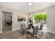 Bright dining room with a glass table, modern chairs, and view of the backyard at 19 E Boca Raton Rd, Phoenix, AZ 85022