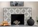 Close-up of a fireplace with decorative tiles and stylish decor at 19 E Boca Raton Rd, Phoenix, AZ 85022