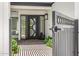 Stunning front entry features a decorative steel security gate and modern front door with sidelights at 19 E Boca Raton Rd, Phoenix, AZ 85022