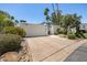Inviting one-story home with a two-car garage, secure gated entry, and beautiful desert landscaping at 19 E Boca Raton Rd, Phoenix, AZ 85022
