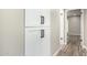 Hallway with white cabinets and black hardware at 19 E Boca Raton Rd, Phoenix, AZ 85022