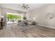 Bright and airy living room with a large sectional sofa and views of the private backyard at 19 E Boca Raton Rd, Phoenix, AZ 85022