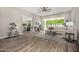 Cozy living room featuring modern furnishings, wood-look tile floors, and large sliding glass door at 19 E Boca Raton Rd, Phoenix, AZ 85022
