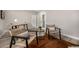 Cozy living room area with wood floors, a cowhide rug, and comfortable seating at 19 E Boca Raton Rd, Phoenix, AZ 85022
