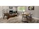 Comfortable living room featuring stylish decor, wood floors, and plantation shutters for natural light at 19 E Boca Raton Rd, Phoenix, AZ 85022