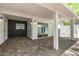 Inviting outdoor patio with sleek black accent wall and covered area for relaxing or entertaining at 19 E Boca Raton Rd, Phoenix, AZ 85022
