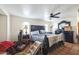 Bedroom featuring dark carved furniture and tile floors, offering a classic and durable design at 1908 E Beck Ln, Phoenix, AZ 85022