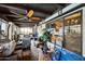 Large enclosed patio with a ceiling fan, tile floor, comfortable seating, and ample space at 1908 E Beck Ln, Phoenix, AZ 85022