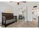 Bedroom with a dark wood crib and mirrored closet doors at 1937 E Loyola Dr, Tempe, AZ 85282