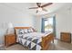 Comfortable bedroom featuring a ceiling fan, a window, and a cozy quilt on the bed at 1937 E Loyola Dr, Tempe, AZ 85282