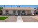 Charming single story home featuring neutral paint, desert landscaping, and a covered porch with seating at 1937 E Loyola Dr, Tempe, AZ 85282