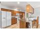 Functional kitchen with stainless steel appliances, tile floors, and a convenient breakfast bar at 1937 E Loyola Dr, Tempe, AZ 85282