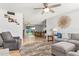 Inviting living room open to the dining area featuring tile floors, a ceiling fan, and cozy seating at 1937 E Loyola Dr, Tempe, AZ 85282