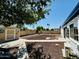 Large backyard featuring low-maintenance desert landscaping, a storage shed, and a block fence at 1941 E Ellis Dr, Tempe, AZ 85282