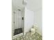 Modern bathroom featuring decorative tile floors, a glass enclosed shower with gold trim at 1941 E Ellis Dr, Tempe, AZ 85282