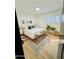 Bright bedroom with hardwood floors, plantation shutters, and a decorative rug at 1941 E Ellis Dr, Tempe, AZ 85282