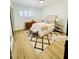 Cozy bedroom with light hardwood floors, shutters, neutral tones, and decorative rug at 1941 E Ellis Dr, Tempe, AZ 85282