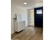Stylish entryway with decorative cabinet, wood floors, and a decorative stained-glass window at 1941 E Ellis Dr, Tempe, AZ 85282