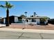 Charming single-story home with desert landscaping, palm tree and American flag at 1941 E Ellis Dr, Tempe, AZ 85282